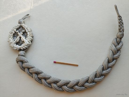 Знак на аксельбанте сотрудника МВД ГДР "За отличную стрельбу"