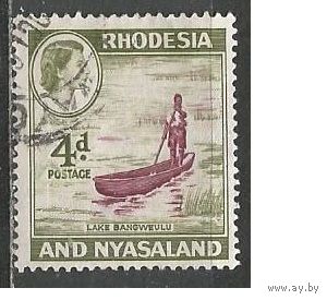 Родезия и Ньясаленд. Королева Елизавета II. Туземец на лодке. 1959г. Mi#24.