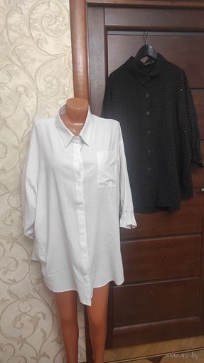 Две стильных рубашки на 66-68 размер. Черная и белая, красиво и красиво мерцают, сидит отлично на фигуре, носила мало, по случаю. Хлопок, очень приятные на ощупь, комфортно сидит на фигуре, ничего не