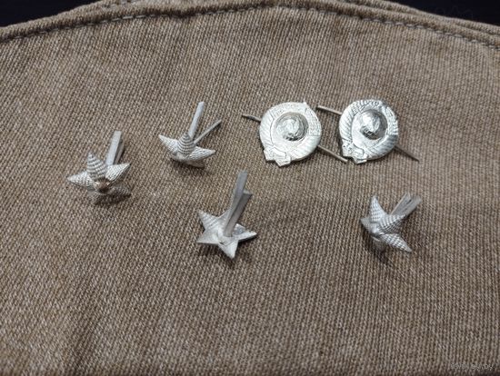 Эмблемы и звёздочки МВД СССР.