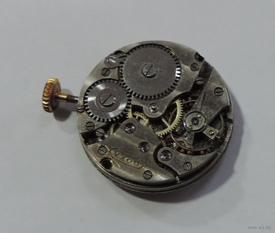 Механизм от наручных часов "DOXA" 30-40-е годы Швейцария. Диаметр 2.4 см. Не исправный. Маятник целый.